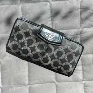 Black and silver Coach Clutch wallet